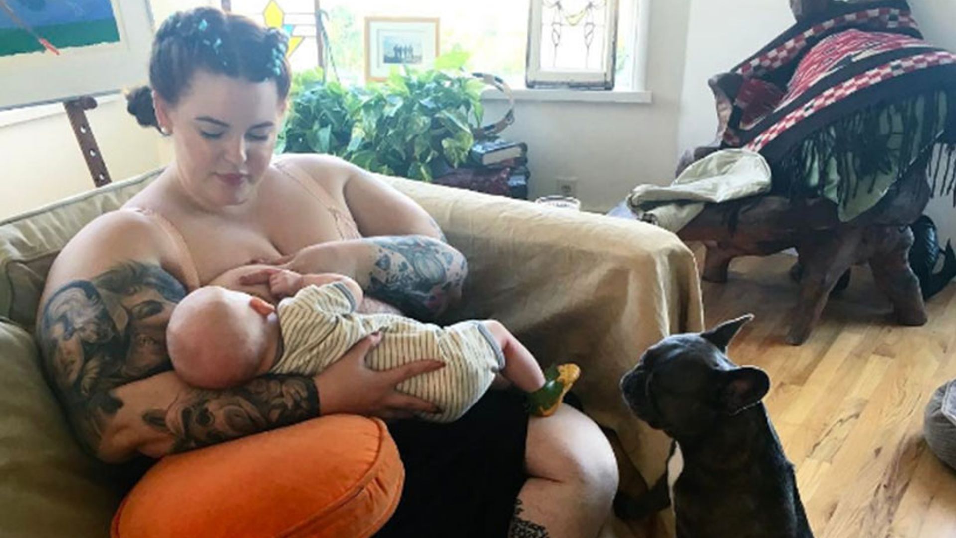 Tess Holliday shares breastfeeding snap as she details motherhood