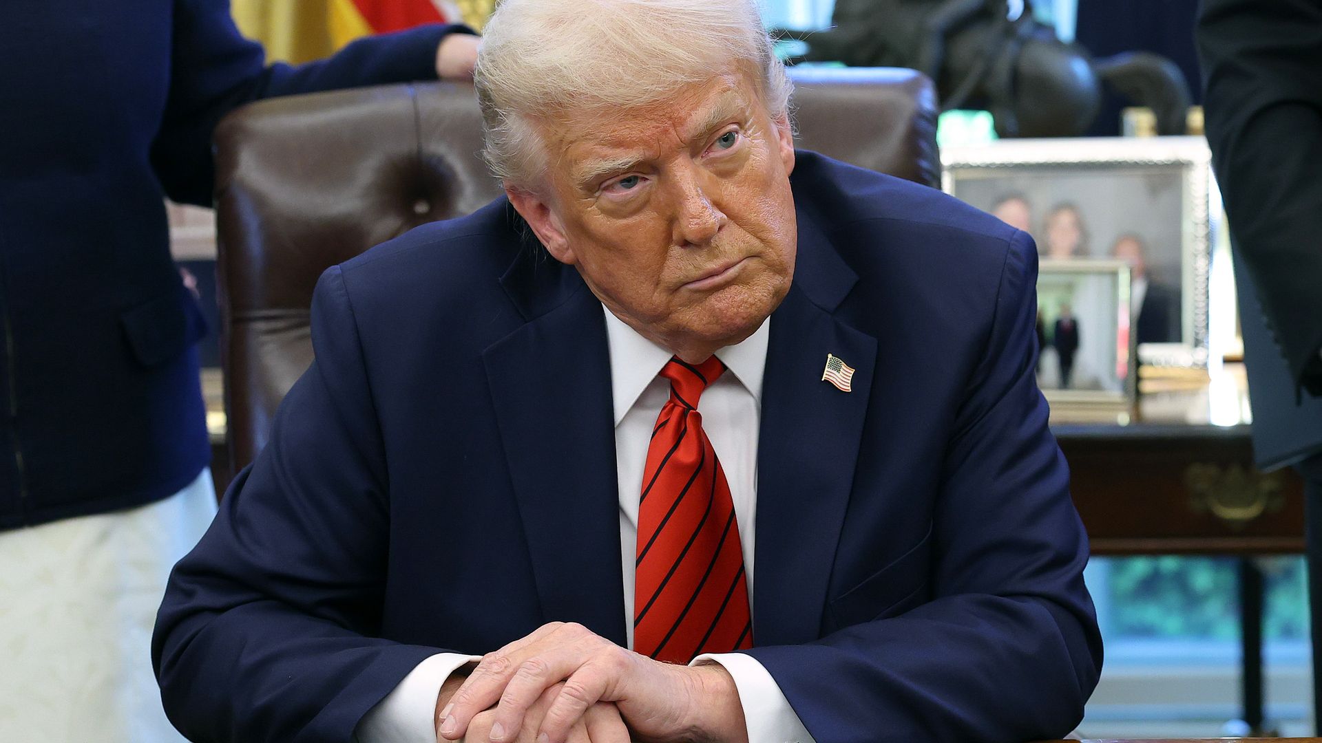 President Donald Trump speaks to reporters after signing a proclamation in the Oval Office