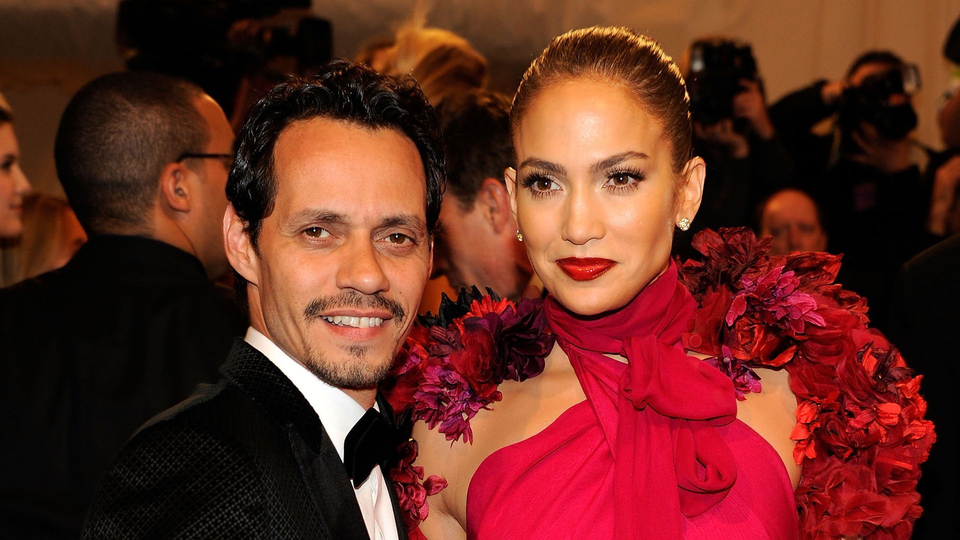 Marc Anthony in tuxedo and Jennifer Lopez in red dress at the 2011 Met Gala