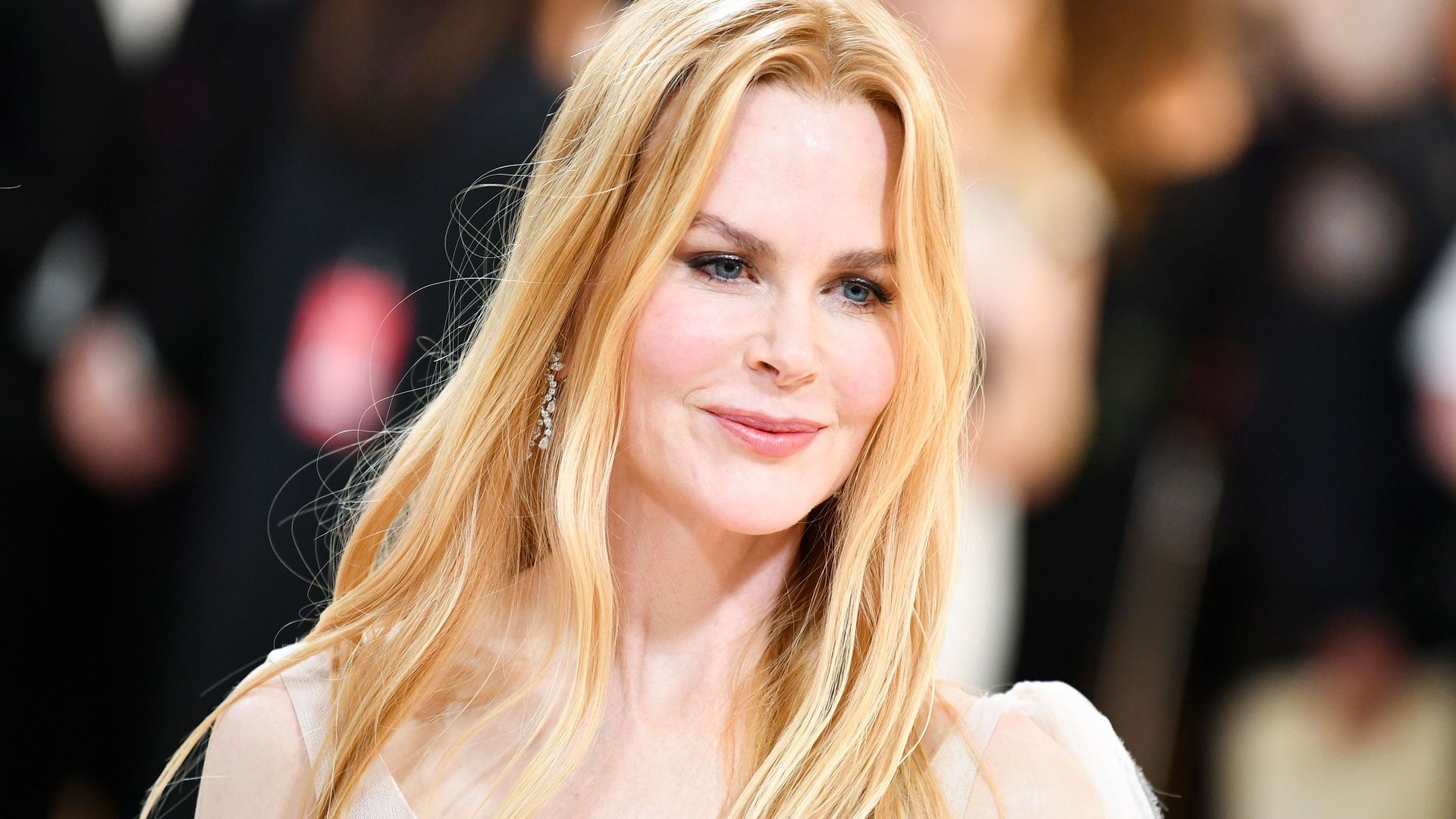Nicole Kidman in a white dress with her hair down