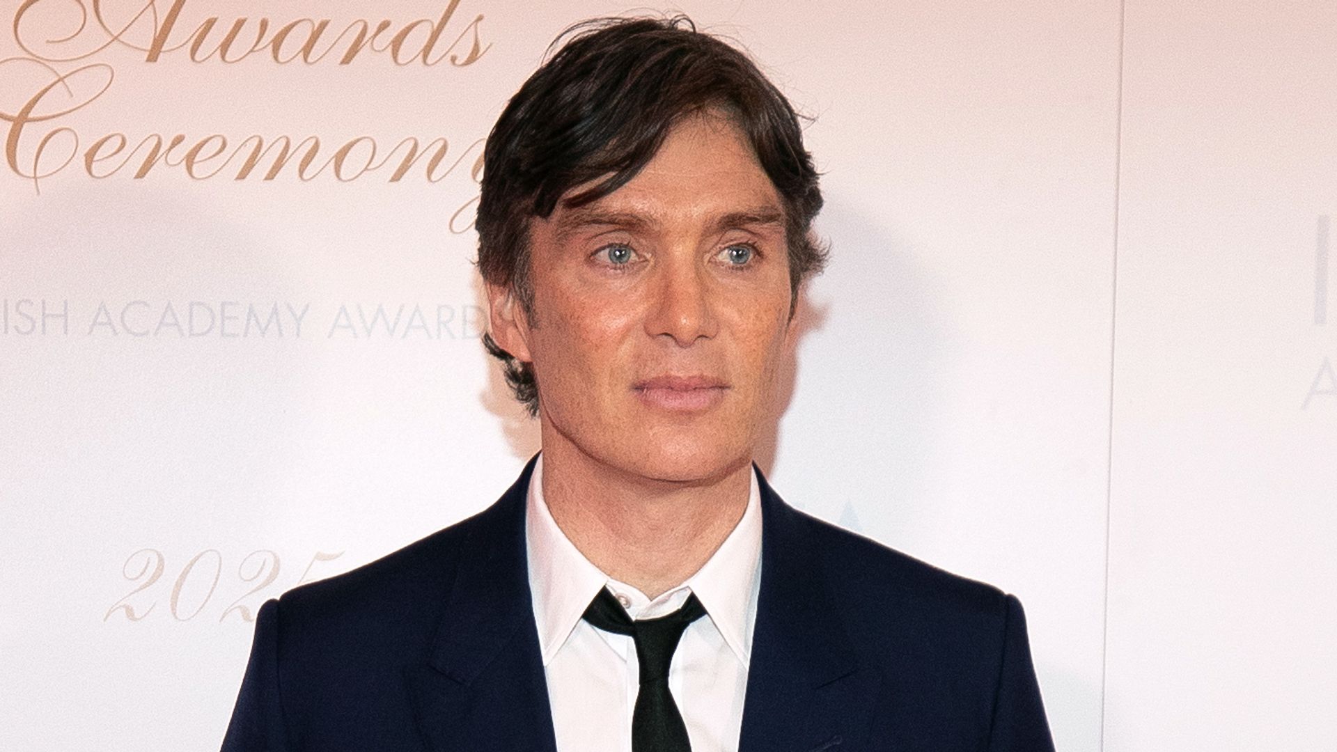 Cillian Murphy wearing a black tuxedo