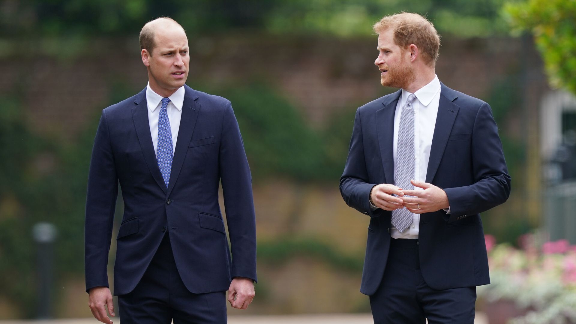 Prince William and Prince Harry arrive for the unveiling of a statue they commissioned of their mother Diana, Princess of Wales