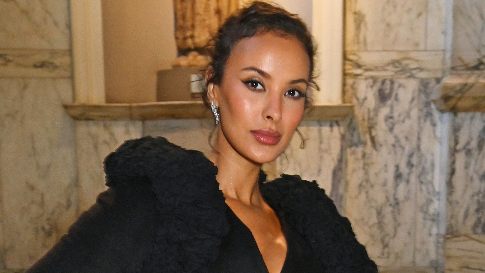 Maya Jama attends 'CARTIER' VIP Private View at The V&A on April 9, 2025 in London, England