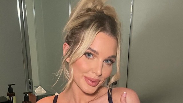 Helen Flanagan wearing blue floral lingerie set posing in bathroom