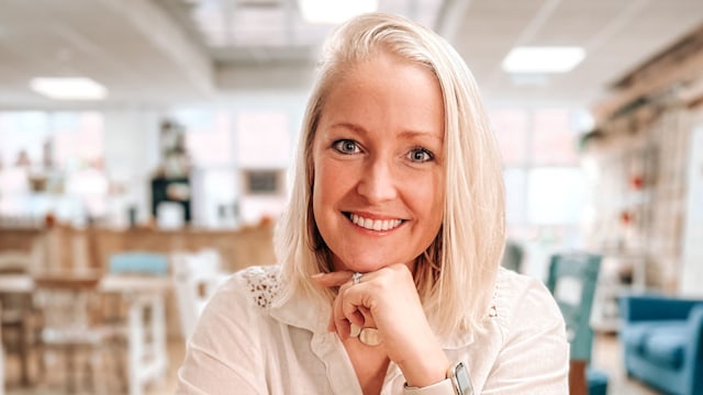 Woman smiling in a white shirt