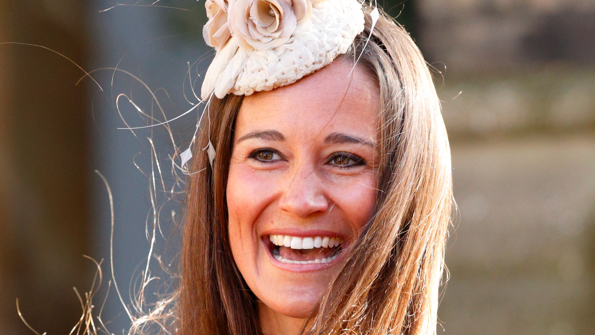 Pippa Middleton at a wedding wearing a fascinator