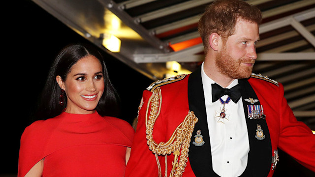 meghan markle in red with prince harry