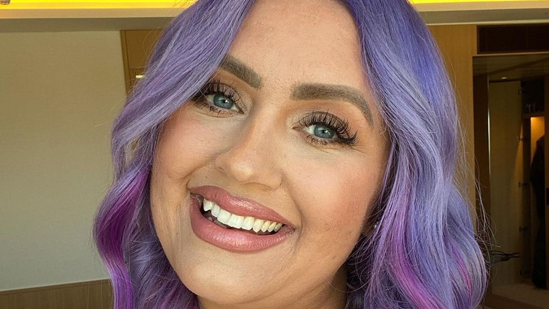 Ellie Warner with purple hair 