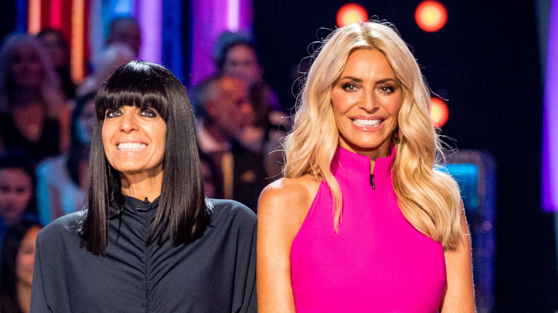 Claudia Winkleman in a black dress and Tess Daly in a pink dress