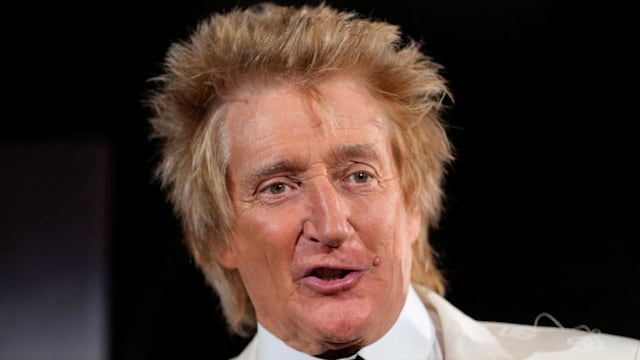 rod stewart in white suit and black tie