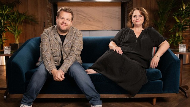 Ruth Corden and James Corden sitting on a sofa