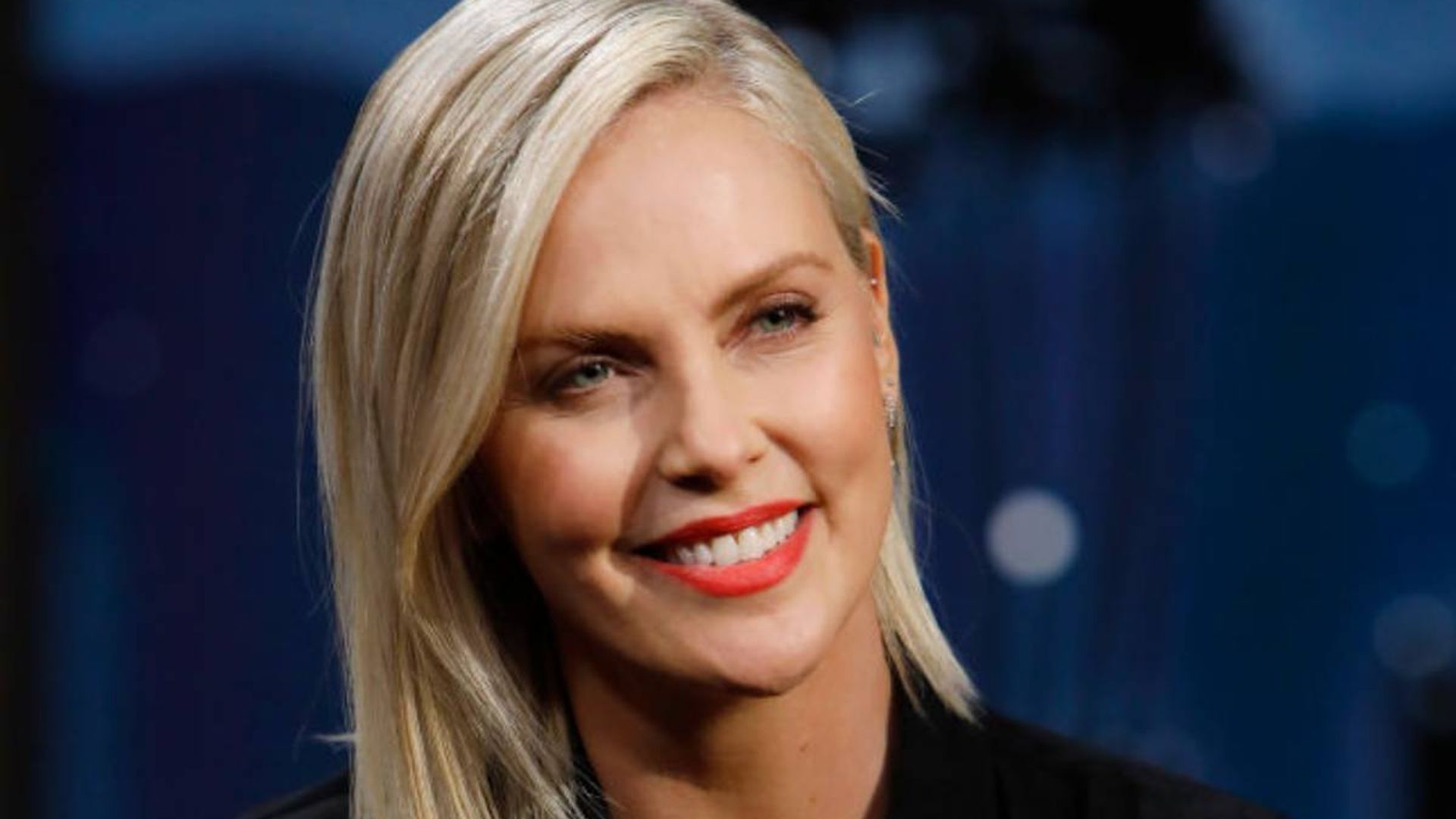 Charlize Theron red lipstick smile