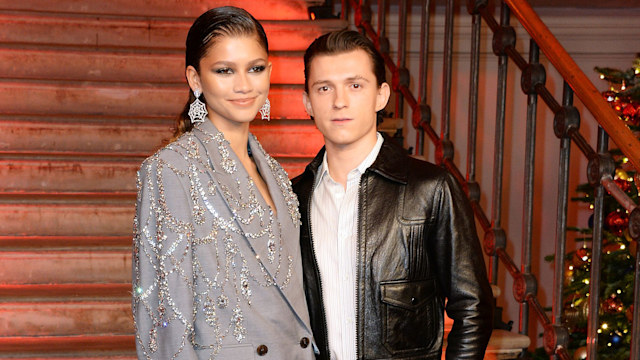 Zendaya and Tom Holland pose at a photocall for "Spider-Man: No Way Home" at The Old Sessions House on December 5, 2021 in London, England.