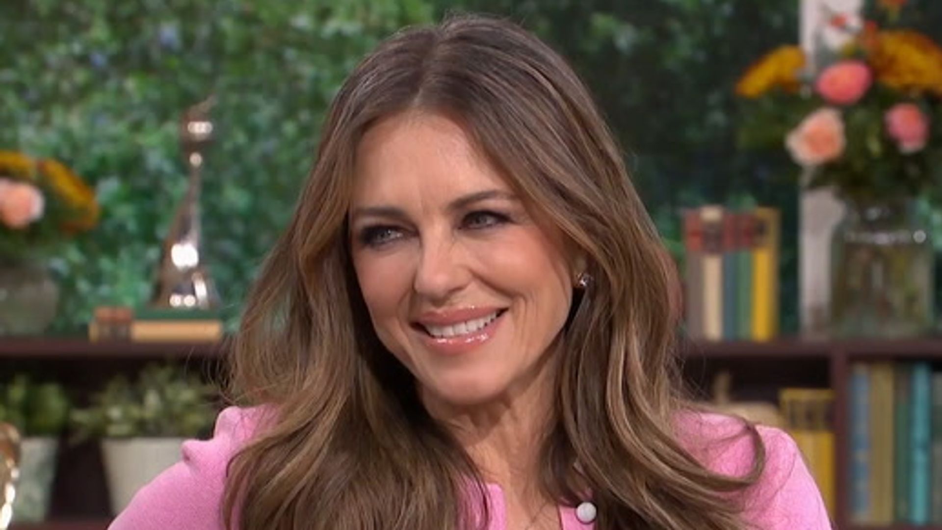 A woman in a pink top