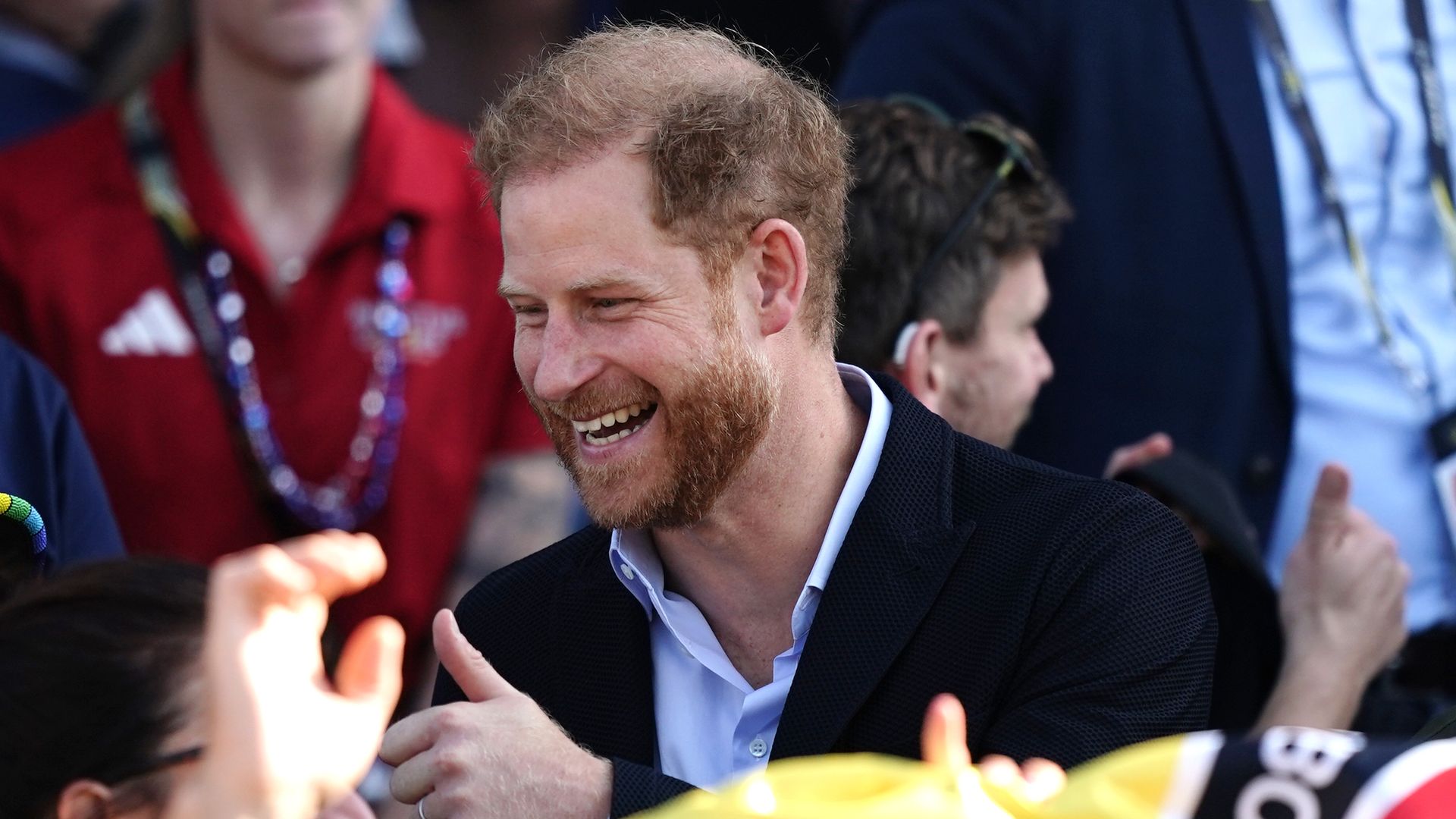 prince harry smiles at crowd 