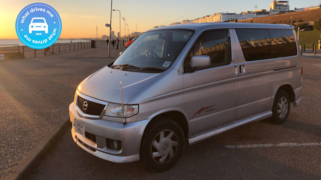 A car near the sea at sunset