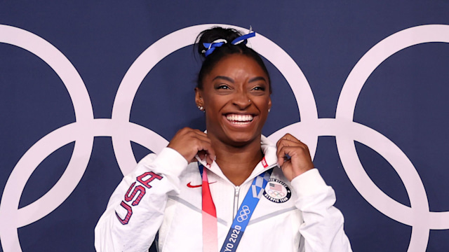 Simone Biles of Team United States poses with the bronze medal following the Women's Balance Beam Final on day eleven of the Tokyo 2020 Olympic Games at Ariake Gymnastics Centre on August 03, 2021 in Tokyo, Japan
