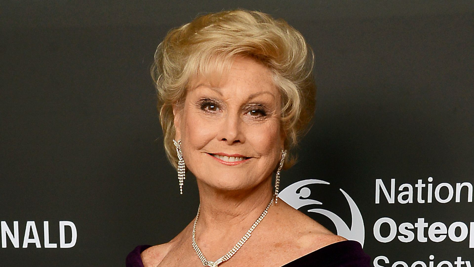 LONDON, ENGLAND - NOVEMBER 21:  Angela Rippon attends the Julien Macdonald Fashion Show for National Osteoporosis Society at Lancaster House on November 21, 2018 in London, England. (Photo by Dave J Hogan/Dave J Hogan/Getty Images for the National Osteoporosis Society)