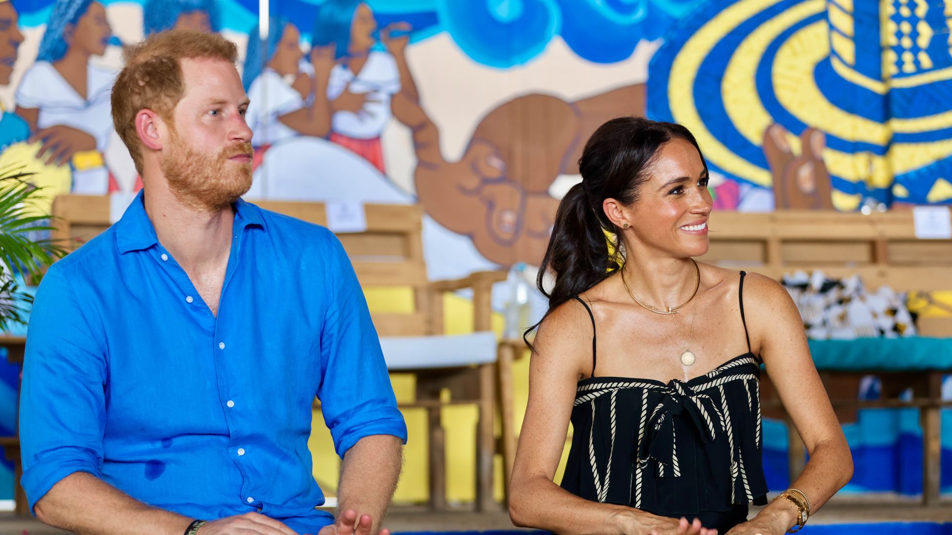 Prince Harry and Meghan Markle playing drums