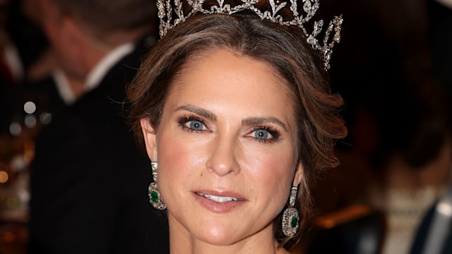 Princess Madeleine shoulders up in green dress and tiara