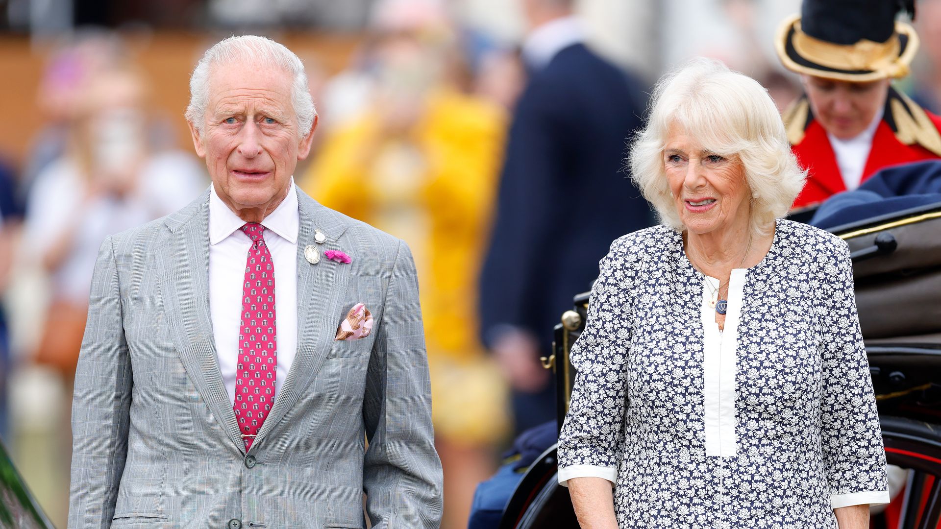 King Charles and Queen Camilla looking serious