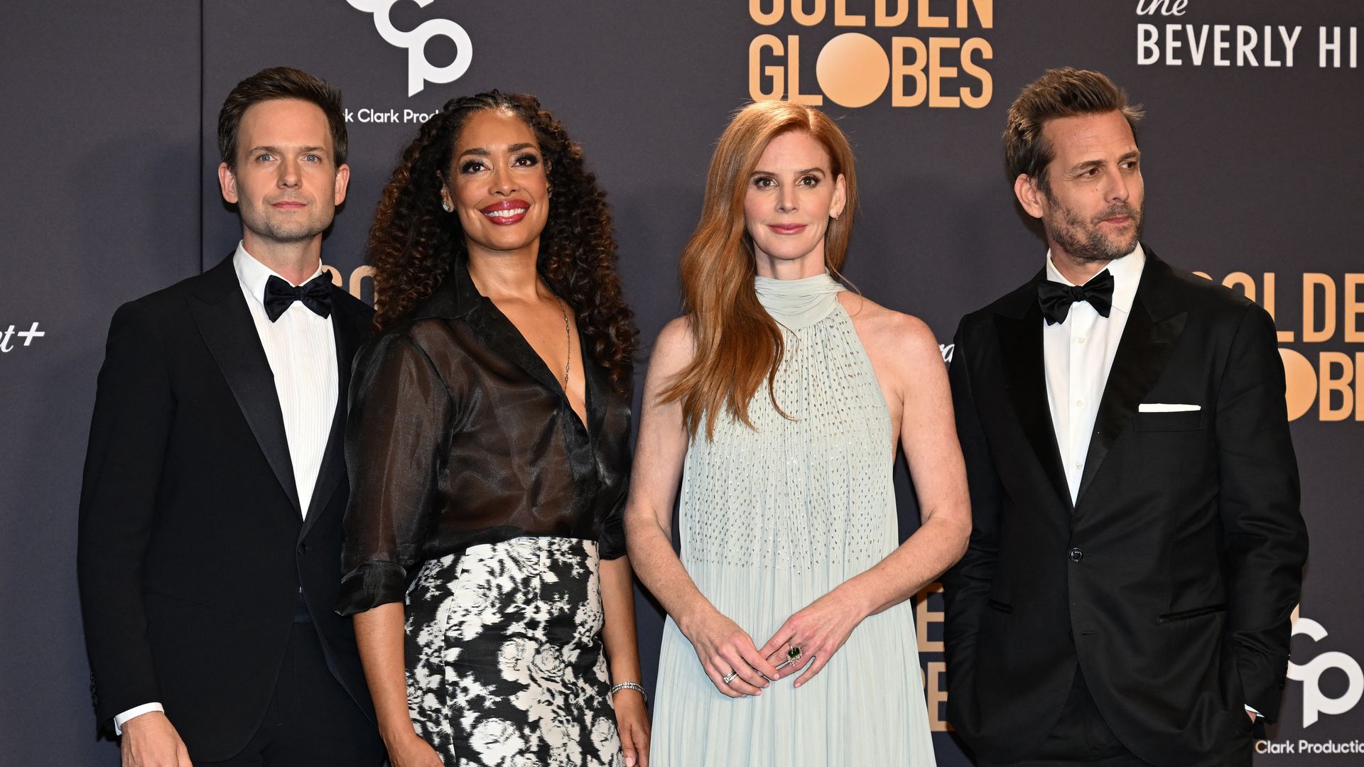 Patrick J. Adams, Gina Torres, Sarah Rafferty and Gabriel Macht pose in the press room during the 81st annual Golden Globe Awards at The Beverly Hilton hotel in Beverly Hills, California, on January 7, 2024