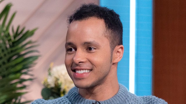 will kirk sitting on sofa in blue jumper