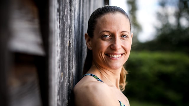 Woman in activewear smiling for the camera