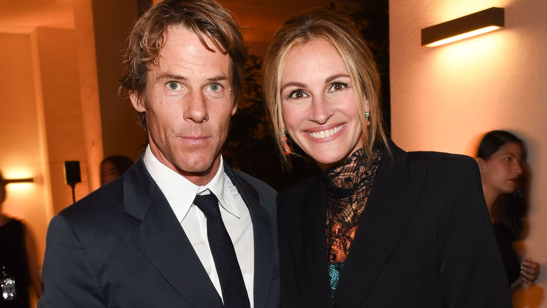 Danny Moder and Julia Roberts smiling at an event