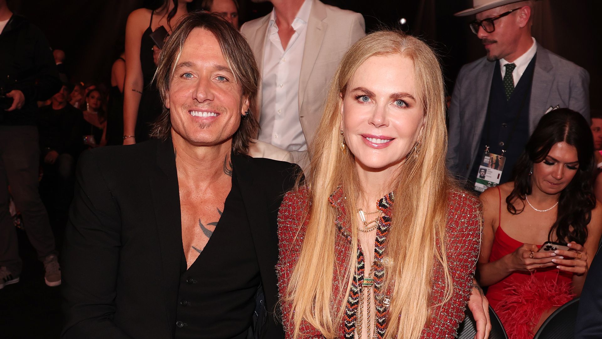 Keith Urban and Nicole Kidman sat smiling at the 58th Academy of Country Music Awards