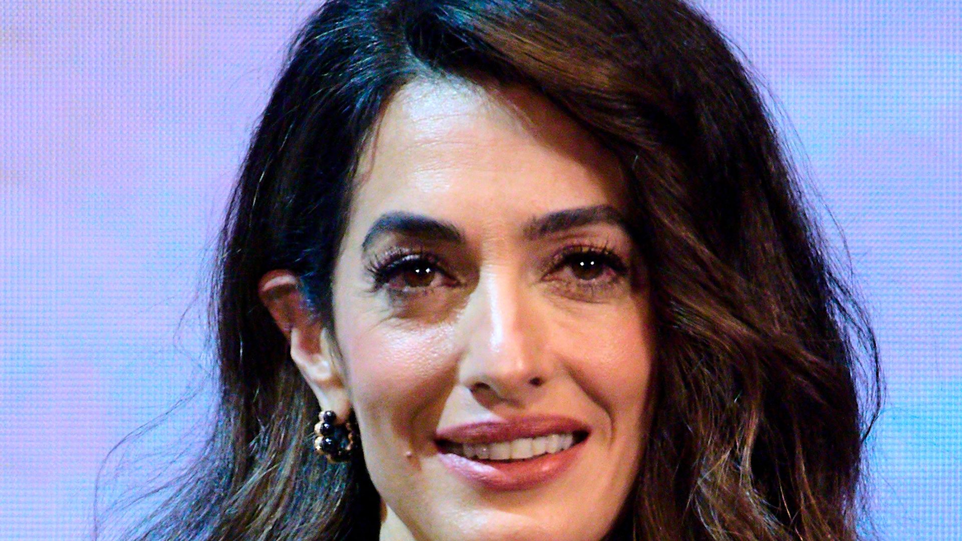 Amal Clooney looks sensational as she steals the show in yellow formfitting jumpsuit