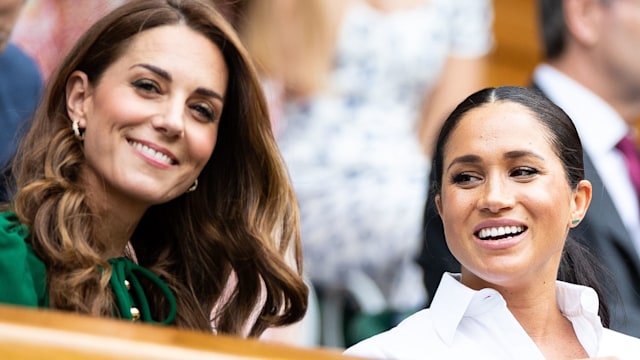 Kate Middleton talks with Meghan Markle, Duchess of Sussex and Pippa Middleton in the royal box before the start of the Women's Singles Final between Simona Halep of Romania and Serena Williams of USA at The Wimbledon Lawn Tennis Championship at the All England Lawn and Tennis Club at Wimbledon on July 13, 2019 in London, England.