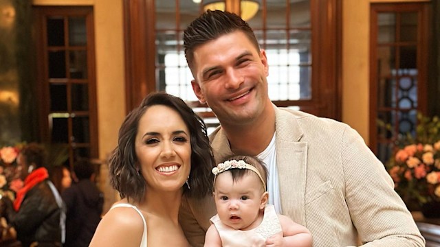 Janette and aljaz holding lyra