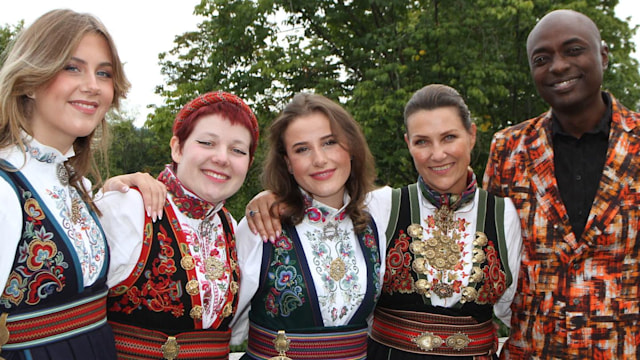 Martha Louise with three daughters in traditional dress and Durek Verrett