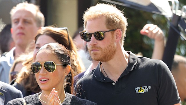 Meghan Markle and Prince Harry in black outfits during the Invictus Games