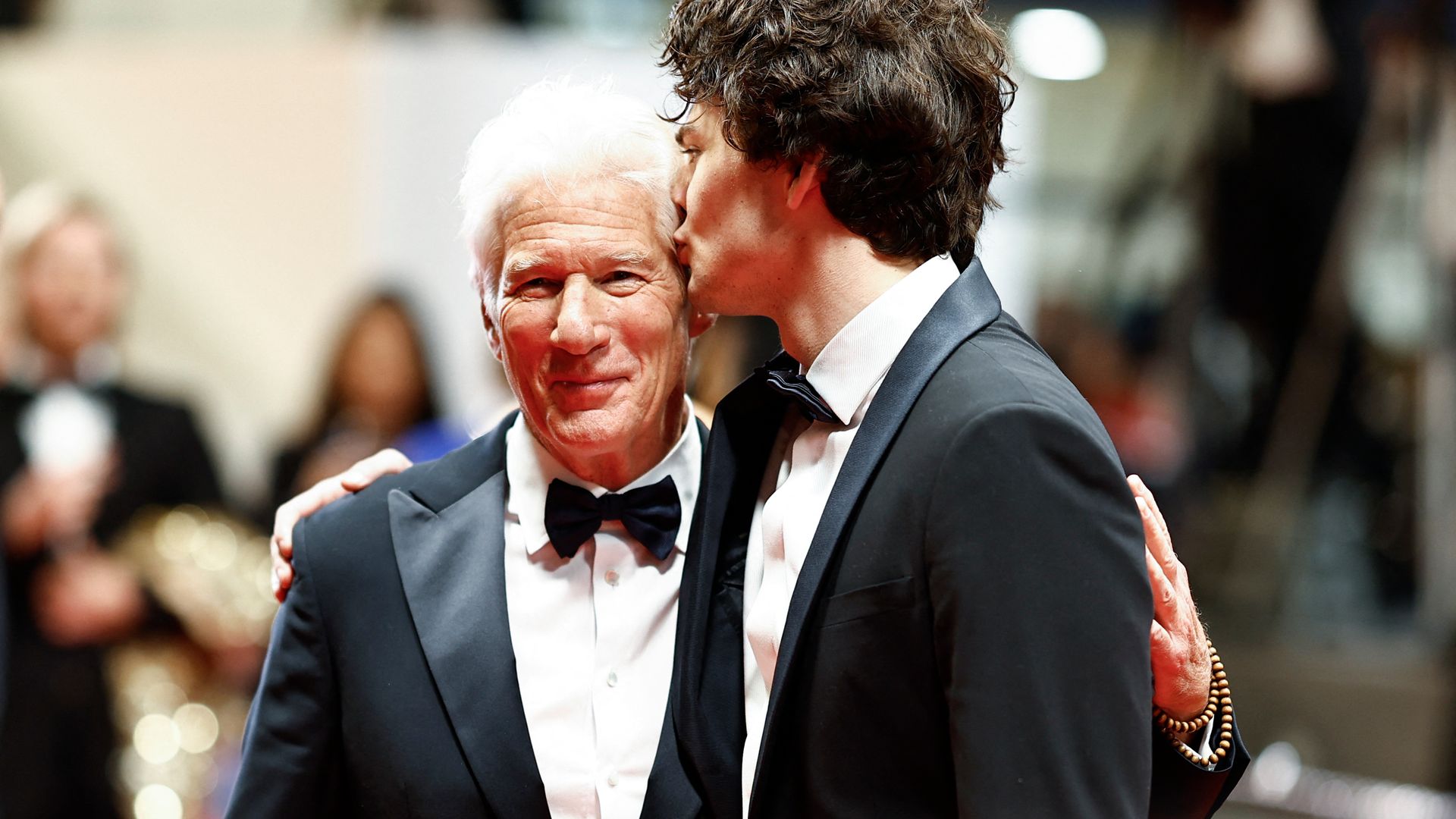 US actor Homer James Jigme Gere (R) kisses his father US actor Richard Gere after the screening of the film "Oh Canada"
