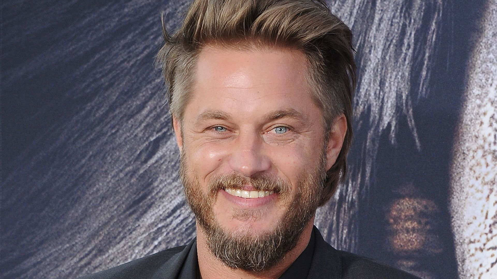 Travis Fimmel smiling at a premiere