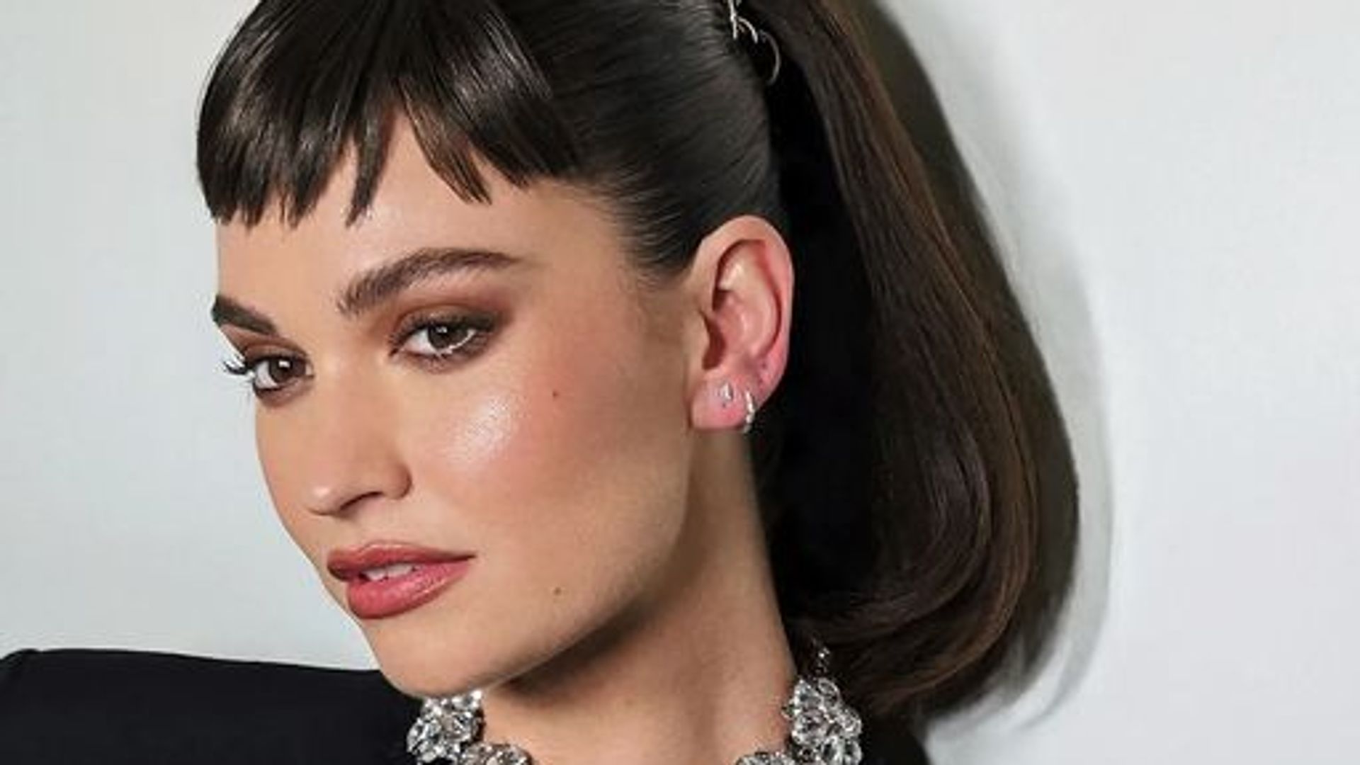 Lily James wore this summer's most bizarre hair accessory and you probably missed it