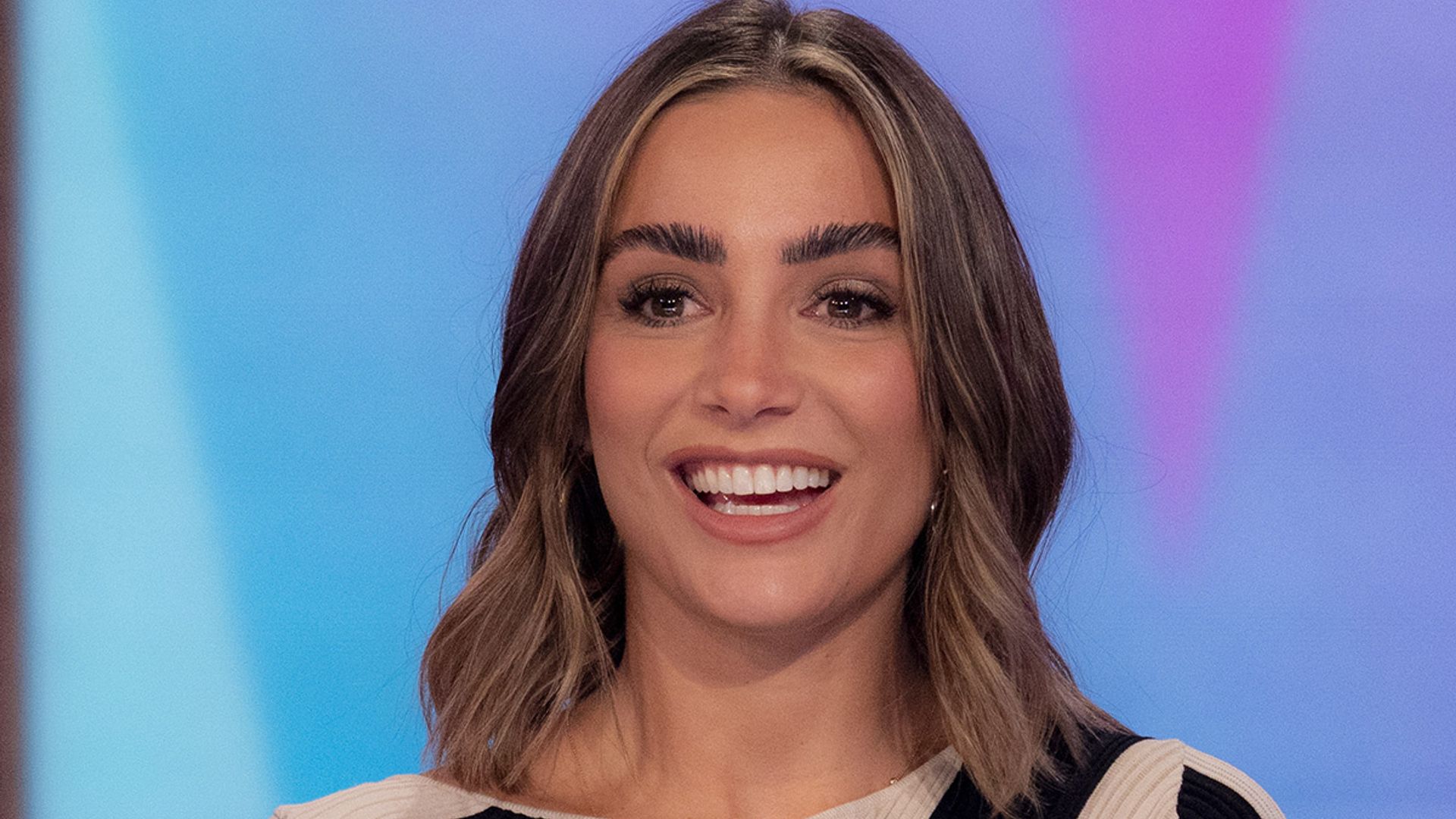 Frankie Bridge stuns in must-see midi dress and leather boots