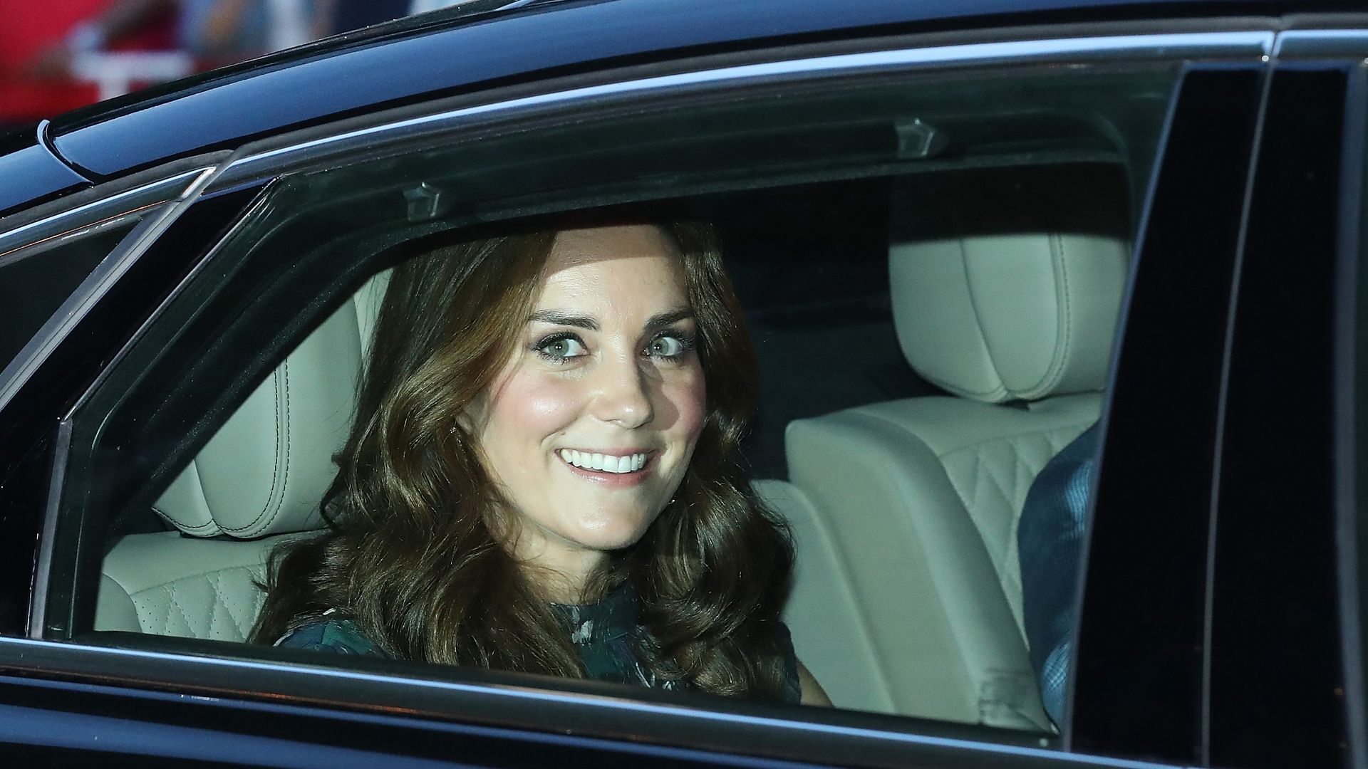 Catherine, Duchess of Cambridge depart in a limousine after attending a reception at Claerchen's Ballhaus dance hall following a day in Heidelberg on the second day of the royal visit to Germany 