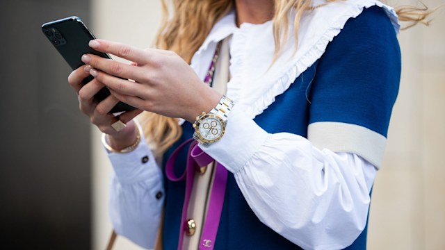 Emili Sindlev wearing a Rolex Daytona watch  during London Fashion Week 