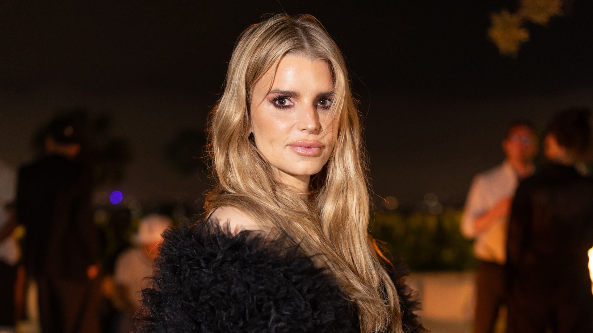 photo of jessica simpson wearing black fur coat