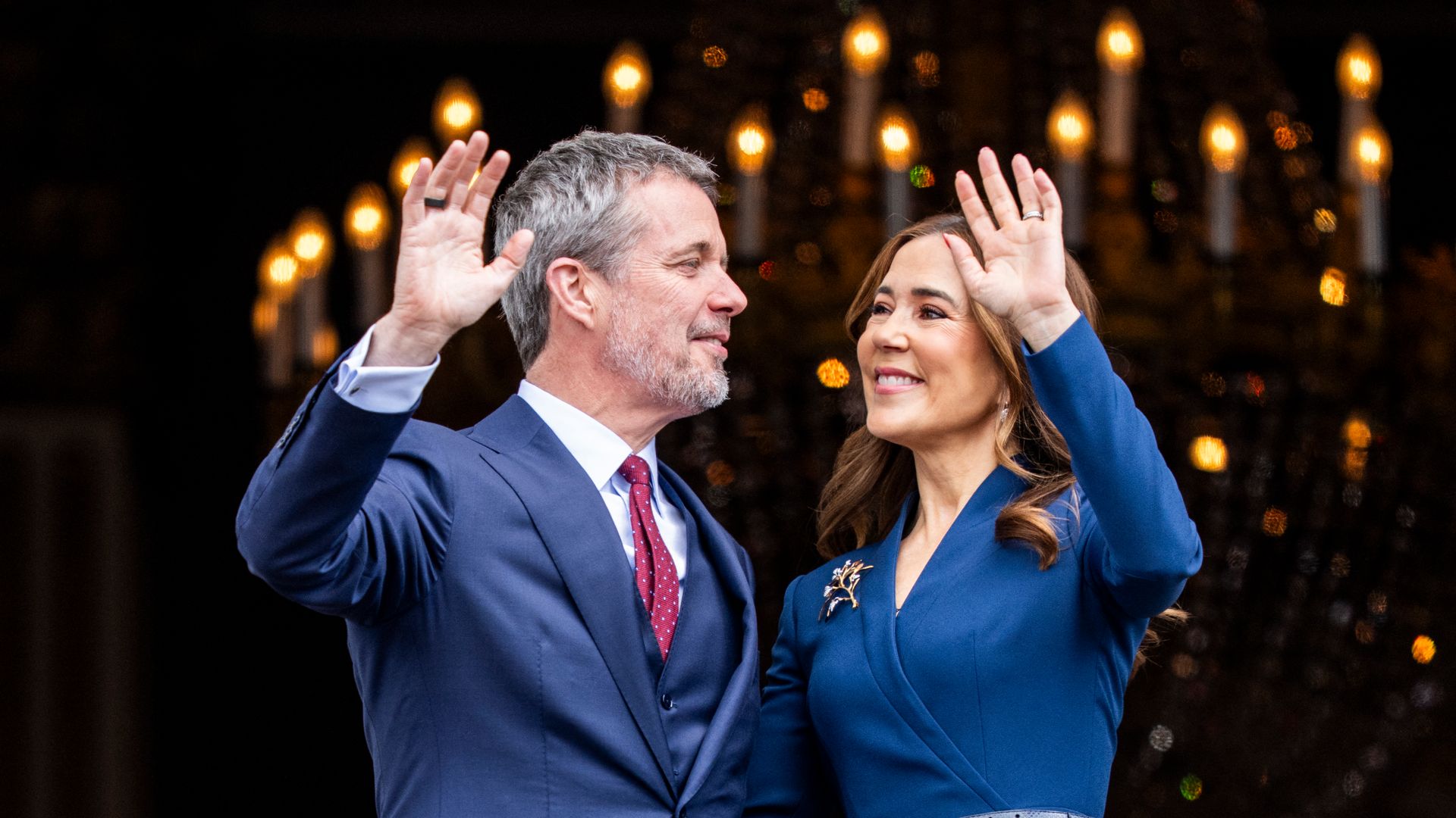 King Frederik and Queen Mary wave from the balcony of Frederik VIII's Palace on the occasion of his 57th birthday