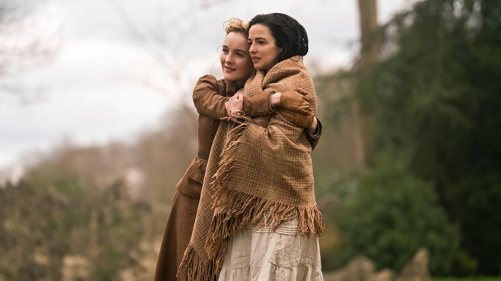 Laura Donnelly and Ann Skelly embracing in a scene from The Nevers