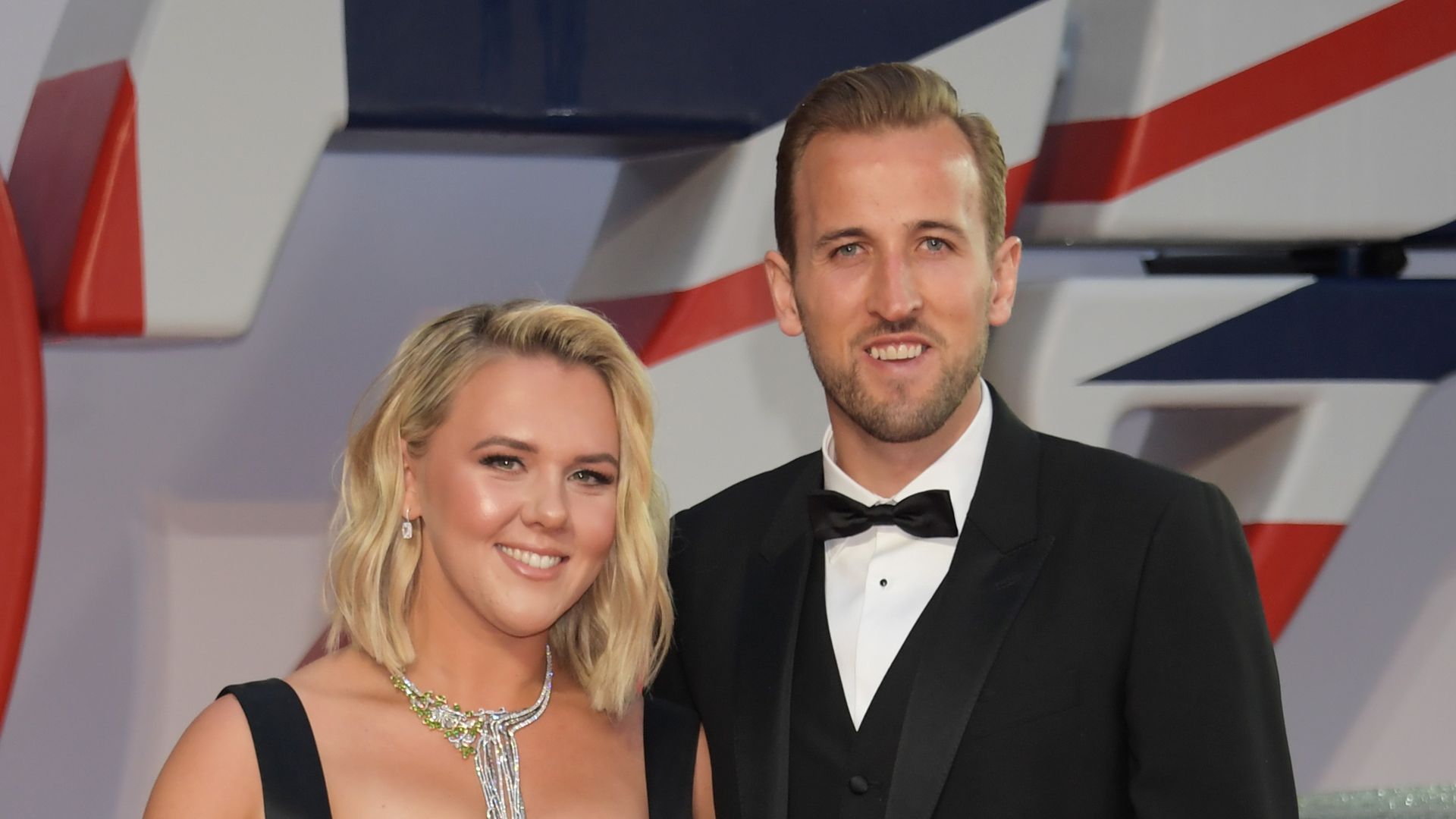 Kate Goodland and Harry Kane in black outfits