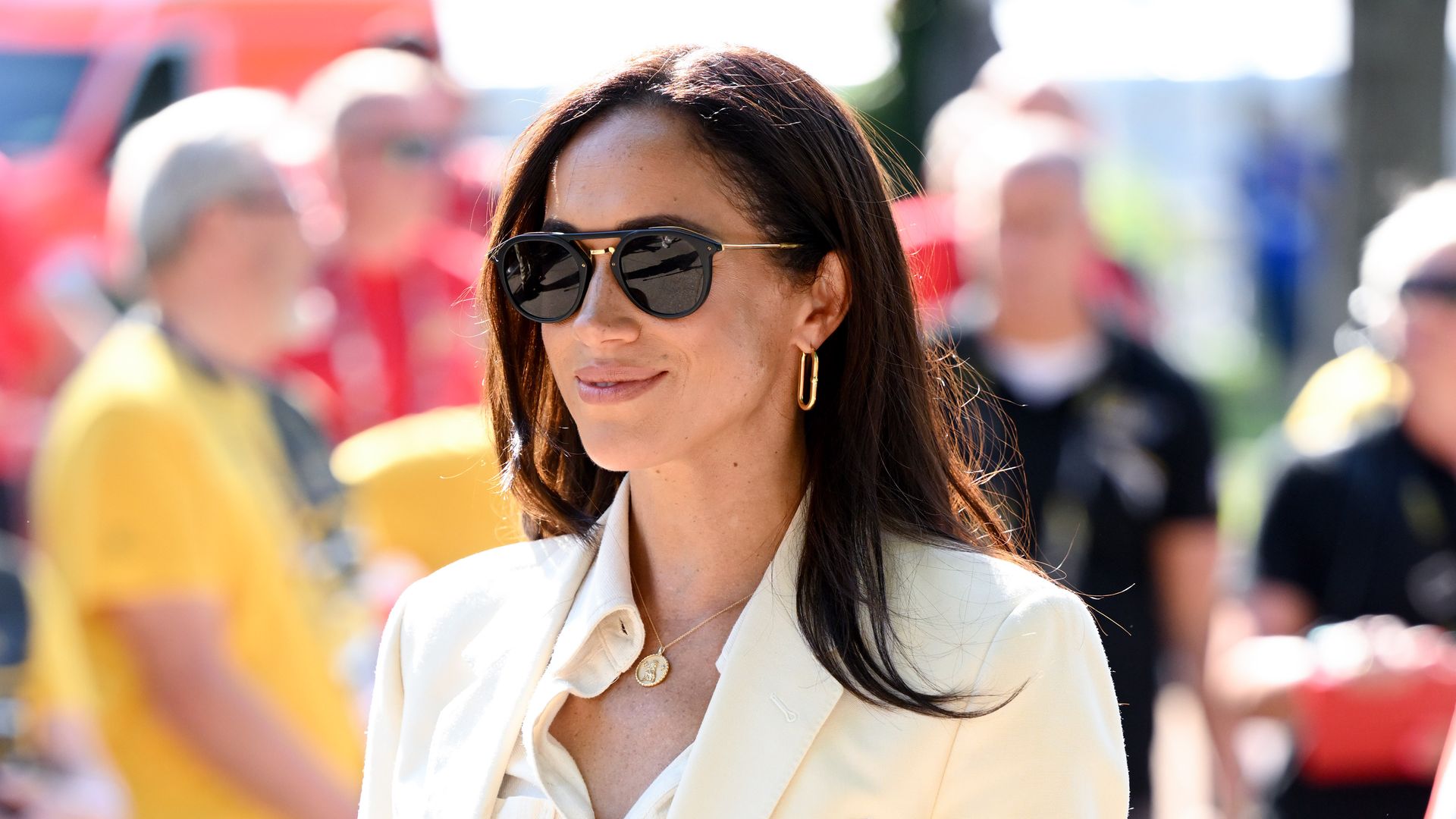 Meghan Markle wearing cream coord and sunglasses at Invictus Games 2023