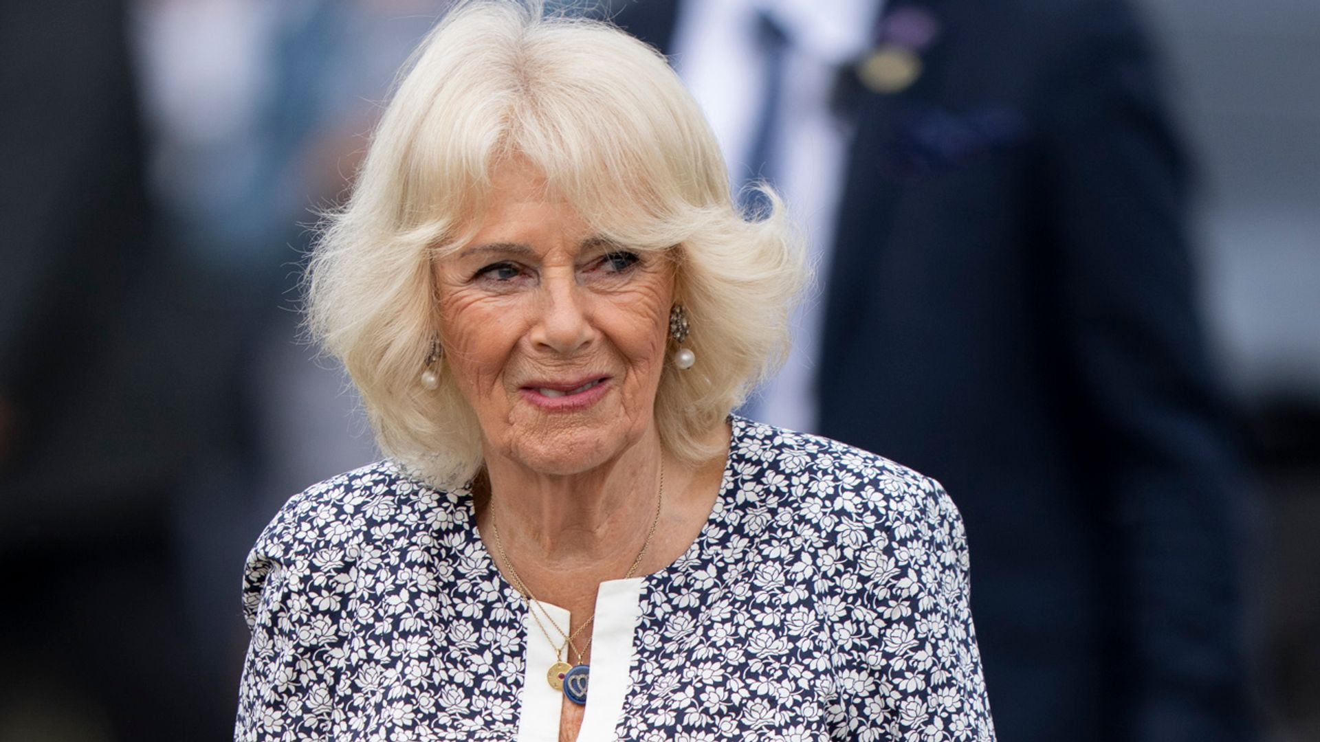 Queen Camilla wearing printed dress