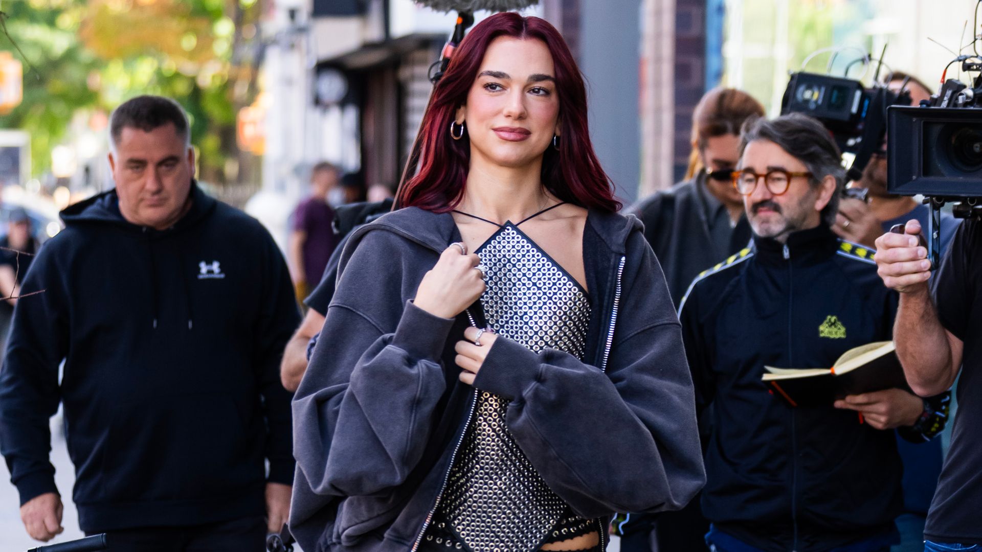 Dua Lipa dazzles in studded top and Y2K leather trousers