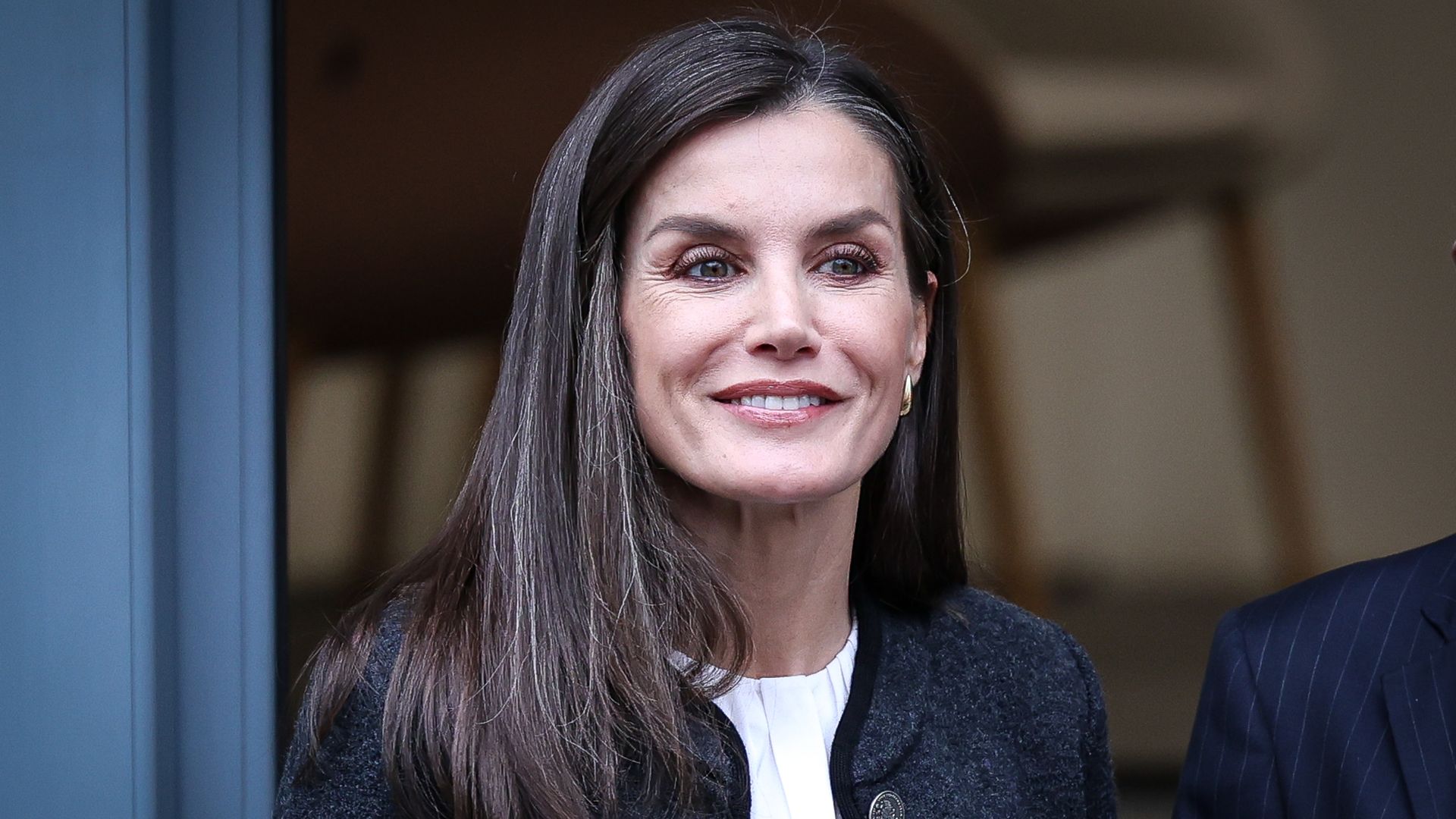 Queen Letizia of Spain in navy jacket and white top