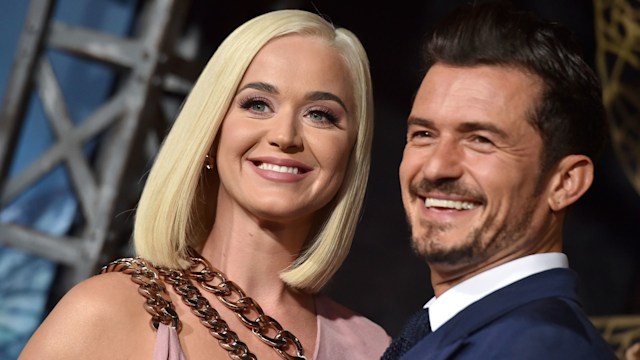Orlando Bloom beams as he poses with his love Katy Perry